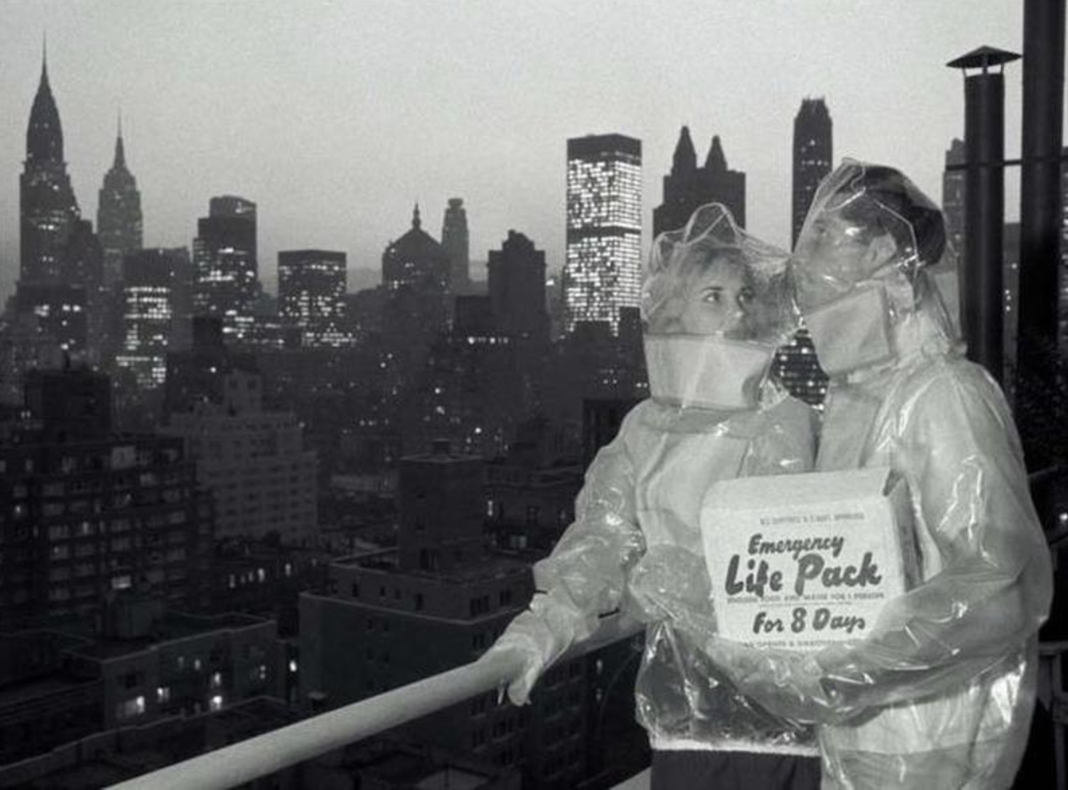 A couple modeling protective suits against nuclear fallout in New York City 